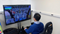 The program allows operators to practice with a video game-like system that features a steering wheel, joystick, pedals and simulated environments.