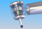 Figure 1: image of a dental turbine head equipped with a rotor, rotor shaft, ball bearings, and drilling tool.