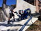 John Agostino exposes the aggregate with the captive shot blaster from Kennards Concrete Care.