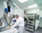 Due to space constraints, Macleod Pharmaceutical selected a Flexicon flexible screw conveyor to transport powder between a ribbon blender to a filling machine. 