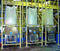 Three identical BFC Series dischargers from Flexicon eliminated health and safety risks associated with dust emissions and spillage, and increased productivity by simplifying the process of manually tying off partially filled bags.